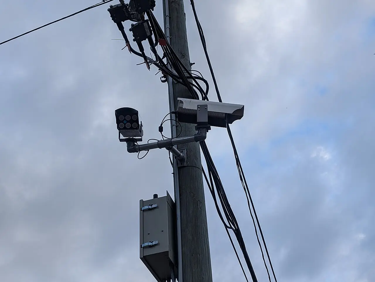 Fixed ANPR number plate recognition cameras mounted on a roadside pole
